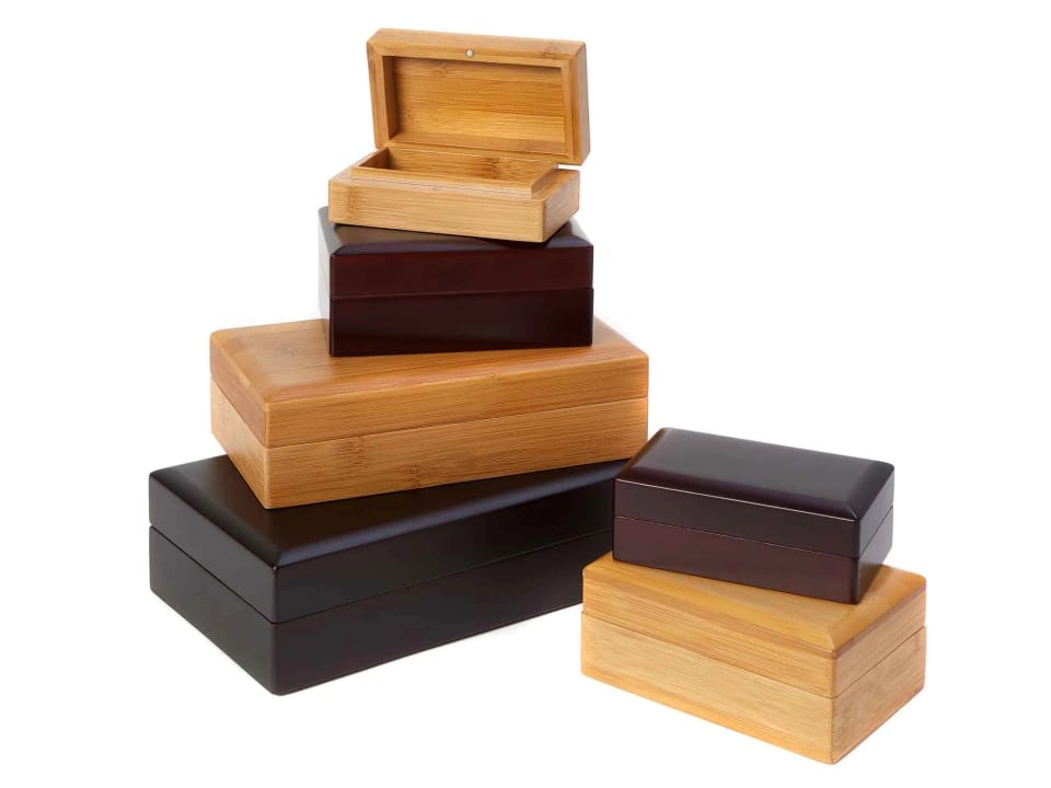 Eden caskets in natural and dark bamboo, in three sizes